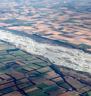 Braided river flowing through highly modified farmland